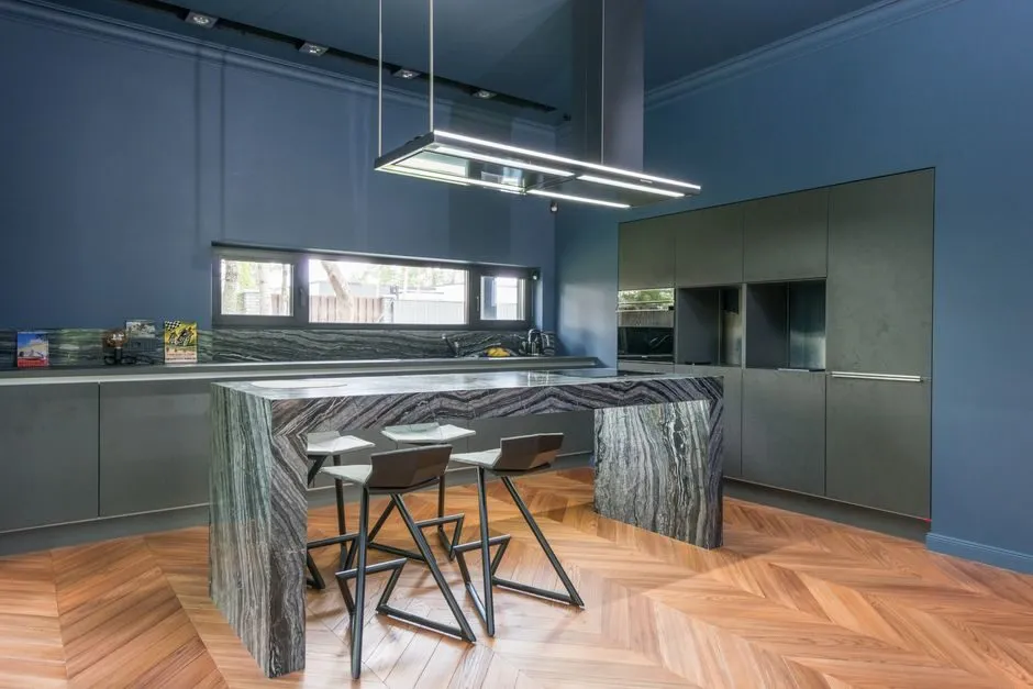 modern minimalist kitchen with sleek cabinets and marble countertop in natural light
