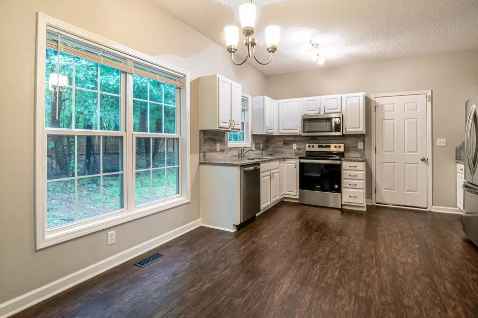 bright kitchen with large windows and natural daylight streaming in