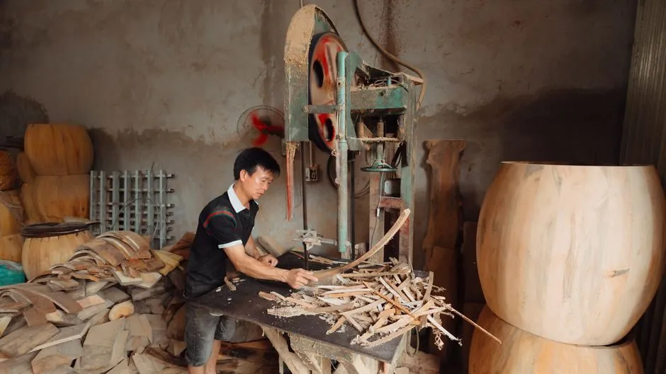 furniture workshop with xoan wood planks being crafted into table