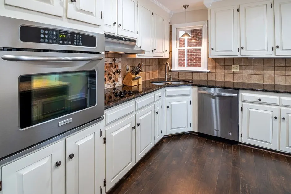 kitchen cabinet price comparison chart on tablet screen